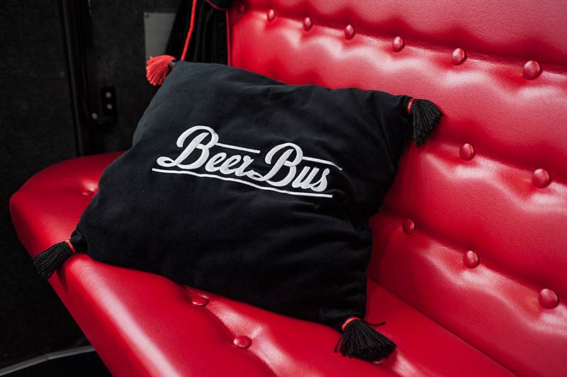 comfy chairs with hand made cushions in beer bus