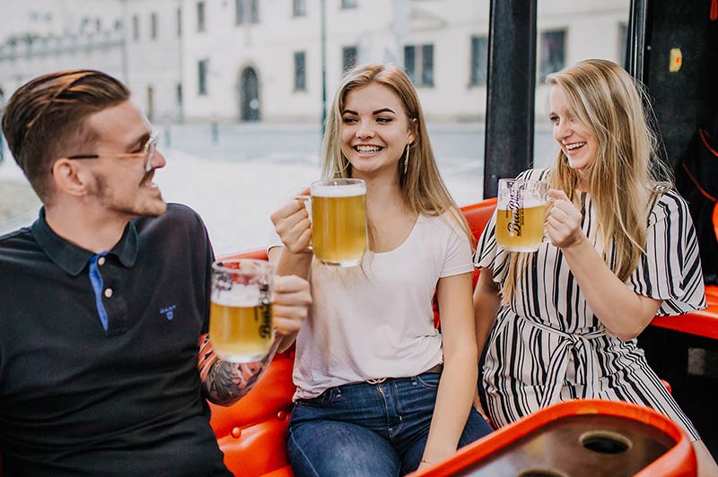 pretty waitress with cup full of beer