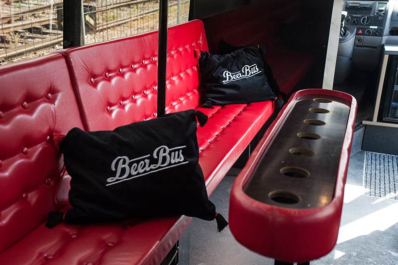 comfy interior of beer bus airport transfer